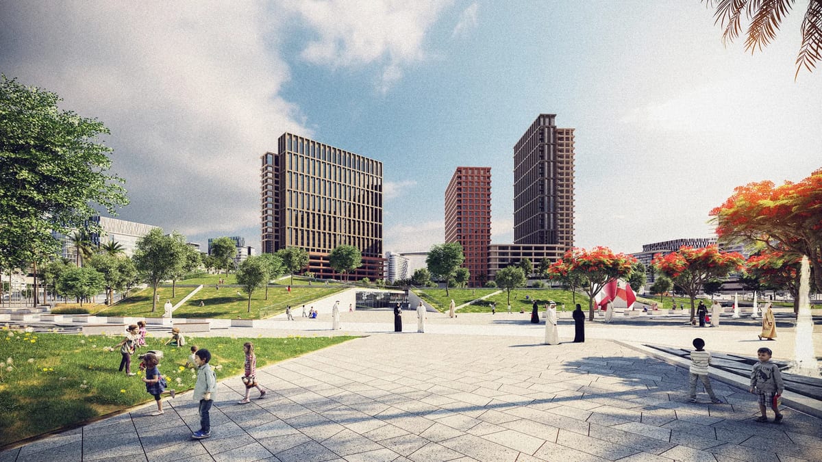 Landscape courtyard of Abu Dhabi co-living project with lawns, paths, and residential towers